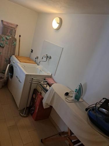 a hospital room with a bed and a sink at B&B " Guzzi - Inn " in Mandello del Lario