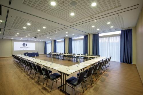 a large conference room with a long table and chairs at DoubleTree By Hilton Milan in Milan