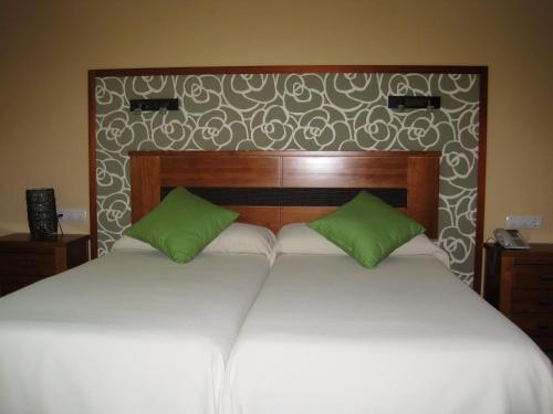 Ένα ή περισσότερα κρεβάτια σε δωμάτιο στο Hotel Sierra Luz