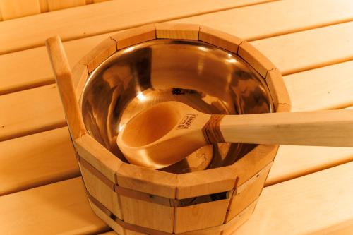 a wooden bowl and spoon in a wooden box at Villa Ashtarak in Ashtarak