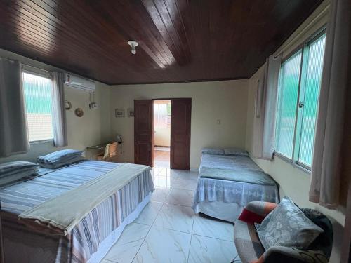 Postel nebo postele na pokoji v ubytování Apartamento Suíte em Soure.