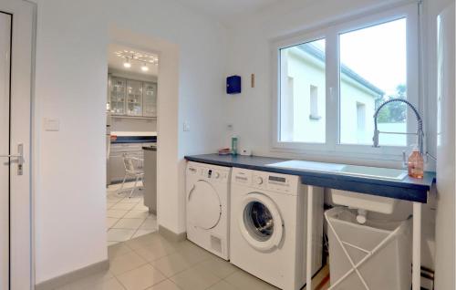 a white laundry room with a sink and a washing machine at Cozy Home In Quettehou With Wifi in Quettehou