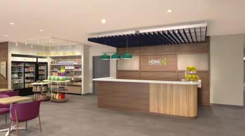 a store with a counter and chairs in a store at Home2 Suites By Hilton Sevierville in Pigeon Forge