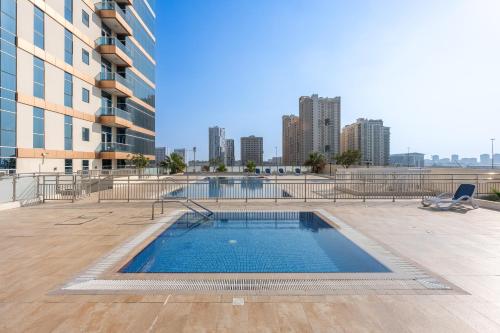 a swimming pool in the middle of a building at Great Gatsby's Home in Dubai