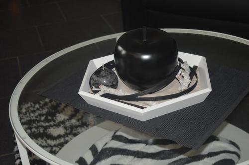 a table with a black ball on top of a table at Echappée Belle in Jalhay
