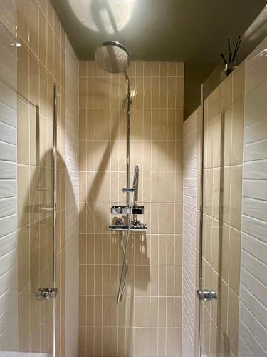 a bathroom with a shower and a glass shower at A Villa di Rutali in Rutali