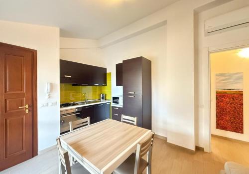 a kitchen with a wooden table in a room at Semplice BnB Bonagia in Valderice