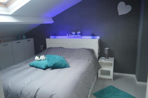 Un pat sau paturi într-o cameră la Echappée Belle