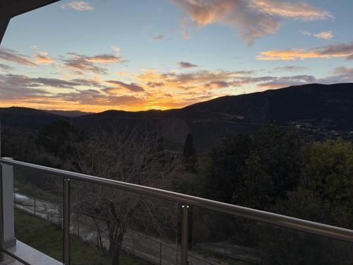 a view of the sunset from the balcony of a house at Afroditi 2 in Angón