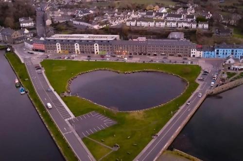 an aerial view of a building with a large lake at Family Fun or Besties Getaway in Westport