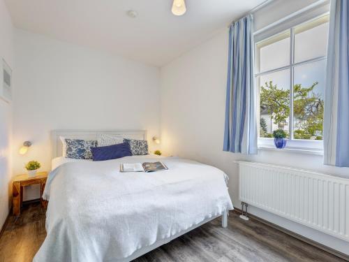 Ένα ή περισσότερα κρεβάτια σε δωμάτιο στο Villa Emmi Wohnung 8