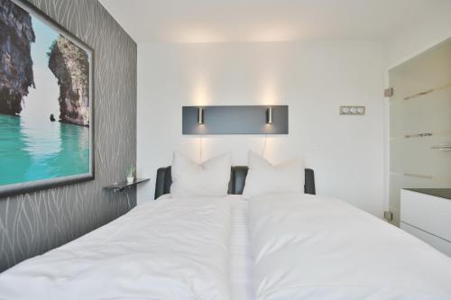Katil atau katil-katil dalam bilik di Strandschlößchen Strandschlösschen Appartement 27