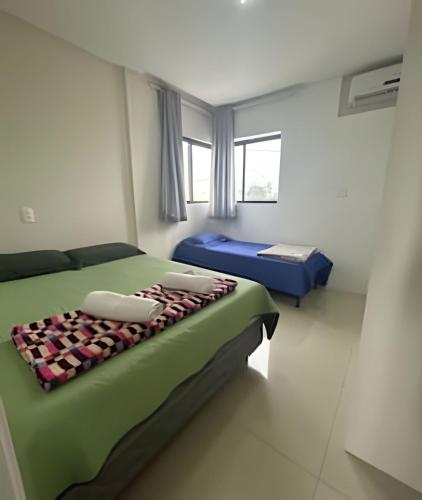 Katil atau katil-katil dalam bilik di 03 quartos (ar condicionado e ventilador), até 10 pessoas, garagem, atrás do hospital da Unimed apt 202