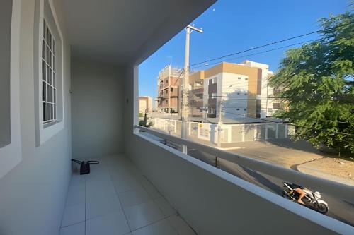 Μπαλκόνι ή βεράντα στο Próx. ao shopping, para 10 pessoas, ar condicionado e garagem APT B