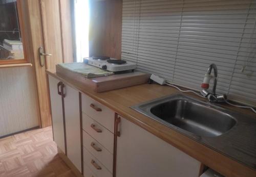 a kitchen with a sink and a counter top at Maspalomas Pasito Blanco N in Pasito Blanco
