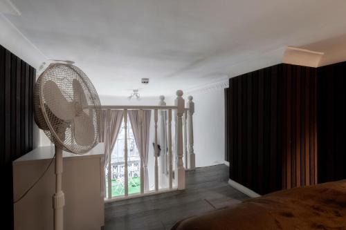 Letto o letti in una camera di Devonshire Terrace Studios