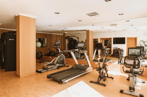 a gym with several exercise equipment in a room at Hotel Hacienda del Conde Meliá Collection Golf & Spa - Adults Only in Buenavista del Norte