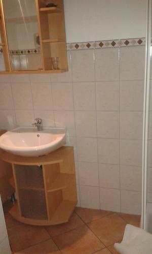 a bathroom with a sink and a mirror at Binderhof in Sankt Johann in Tirol