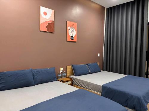Postel nebo postele na pokoji v ubytování Nguyễn Tân Homestay Near Beach BBQ Free Mỹ Tân
