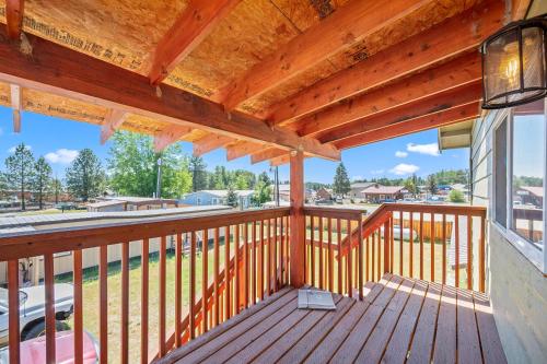 a deck with awnings and a view of a street at Birch Glen Hotel in Cascade