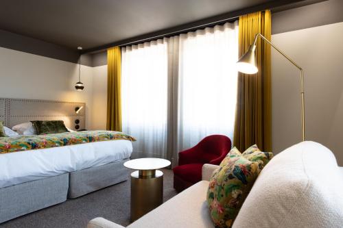 Postel nebo postele na pokoji v ubytování Hôtel de l'Abbaye Lyon - Boutique Hôtel