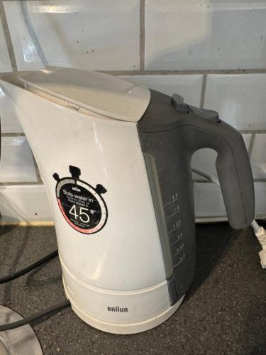 a black and white toaster sitting on a counter at Guesthouse Centrum in Oslo