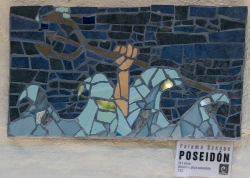 a stained glass window of a person holding a cross at Suites Atlantis in Punta del Este