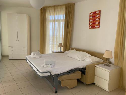 Postel nebo postele na pokoji v ubytování Solidago Residence