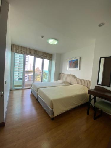 Ένα ή περισσότερα κρεβάτια σε δωμάτιο στο Seaview & Mountainview Private Condo Room, Cha-am