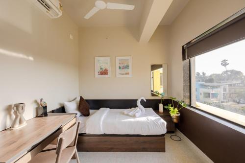 Ein Bett oder Betten in einem Zimmer der Unterkunft Saavi Suites