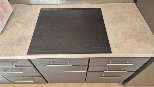 a counter top with a laptop on top of it at Alina's DIY-Haus St.Jakob in Innere Großrotte
