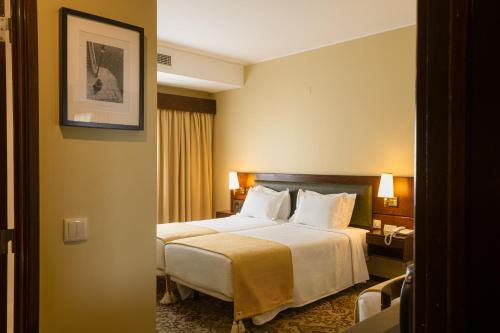 Postel nebo postele na pokoji v ubytování Hotel Sao Jose