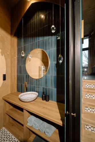 a bathroom with a sink and a mirror at Villa Marrakesh Noszvaj in Noszvaj