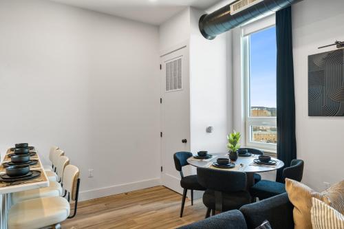a dining room with a table and chairs at 2BR, King Bd, Free Prkn, Gym, NYC View, 8min Train in East Orange