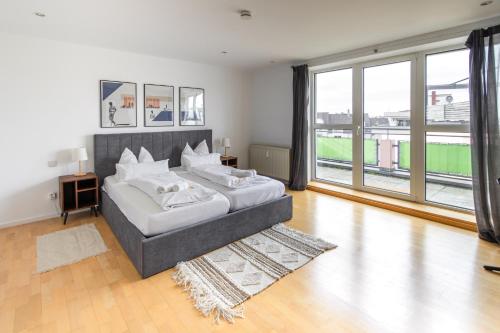 Postel nebo postele na pokoji v ubytování Penthouse-Maisonette - City Center, Highspeed Internet, Garage