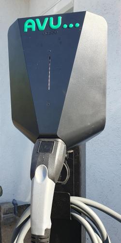 a awu machine with a cord plugged into it at Ferienhaus Höller in Grömitz