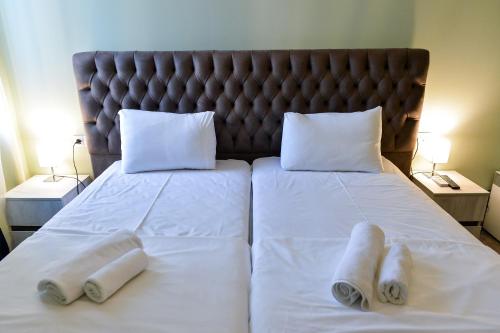 Four Seasons Riversideにあるベッド
