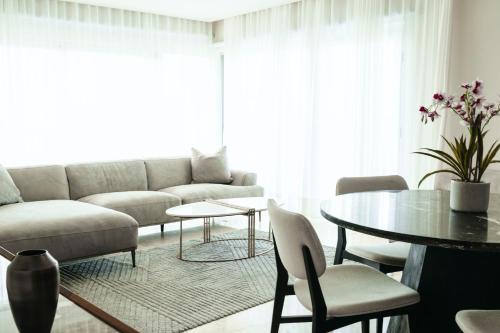 a living room with a couch and a table at Cofresi Hills Residence in Gurapito