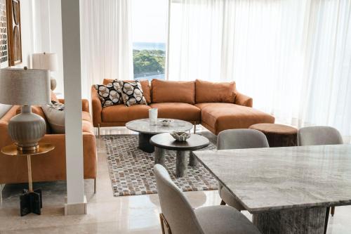 a living room with a couch and a table at Cofresi Hills Residence in Gurapito