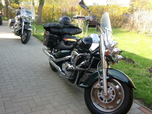 a black motorcycle parked on a sidewalk at Ferienhaus Schöne in Lebbin in Groß Teetzleben