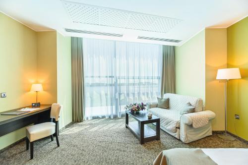 Кровать или кровати в номере Vega Hotel