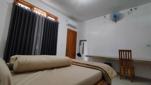 Postel nebo postele na pokoji v ubytování P'Moon Open Inn