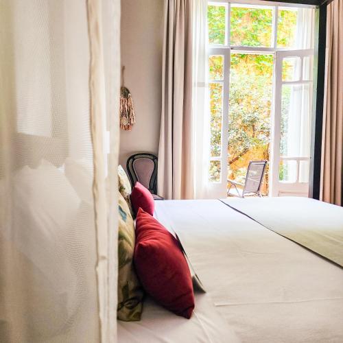 Postel nebo postele na pokoji v ubytování Legado Mitico Salta Hotel Boutique