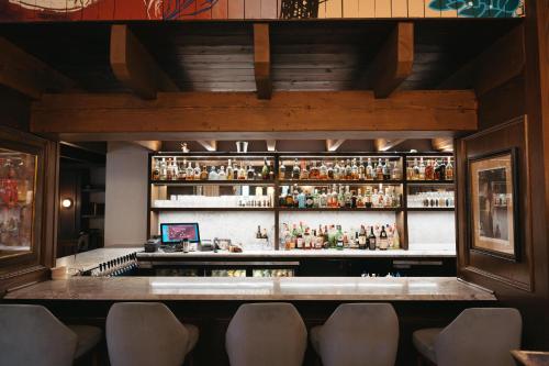 a bar with a lot of bottles of alcohol at The Lord Nelson Hotel & Suites in Halifax