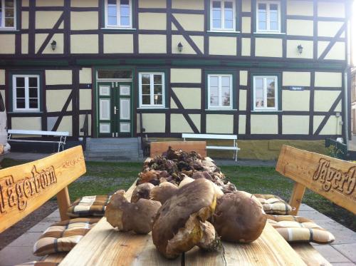 a group of vegetables on a table in front of a building at HausJägerborn in Tanne
