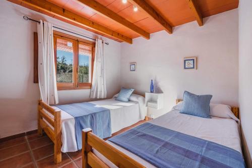 A bed or beds in a room at Villa Vinyes by Villa Plus