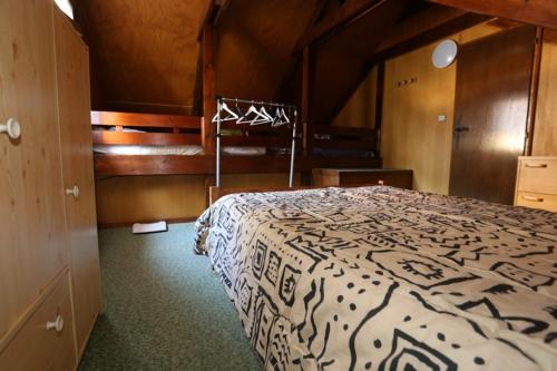 Un ou plusieurs lits dans un hébergement de l'établissement Location magnifique chalet pour 10 personnes