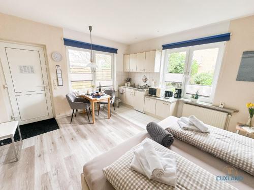 Postel nebo postele na pokoji v ubytování Ferienhaus Bungalow nahe Kurpark Döse