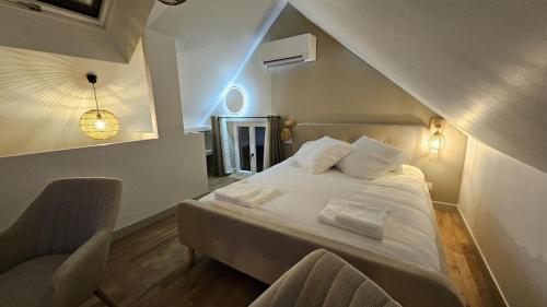 Postel nebo postele na pokoji v ubytování La Suite Chêne