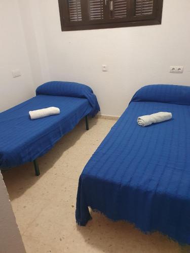 Cama o camas de una habitación en PISO 1ª LINEA SANLUCAR DE BARRAMEDA